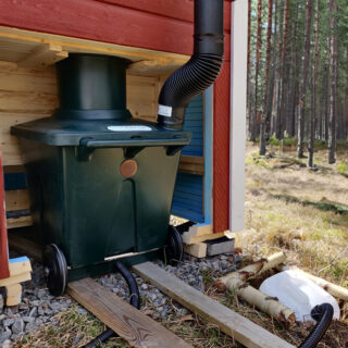 Green Toilet 120 Family installed underneath outhouse seat