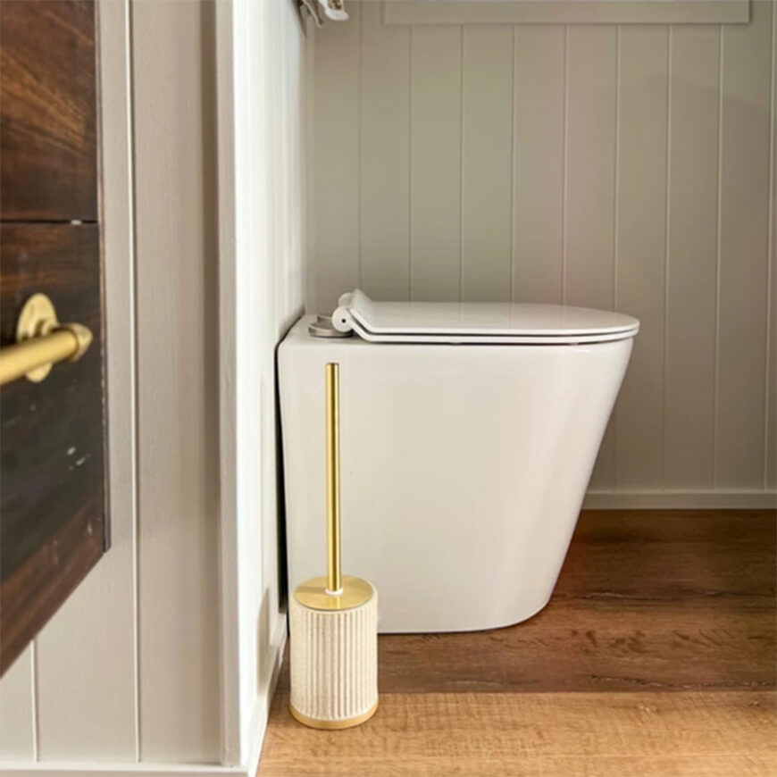 waterless toilet pedestal from side inside a tiny house