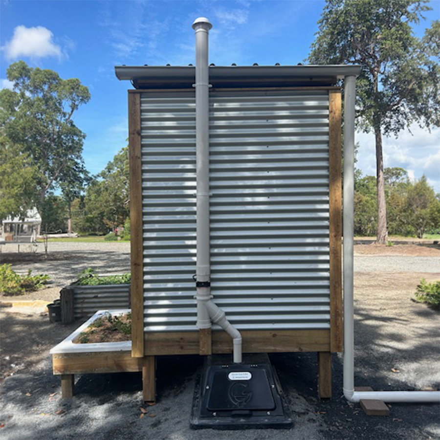 split system outhouse from behind