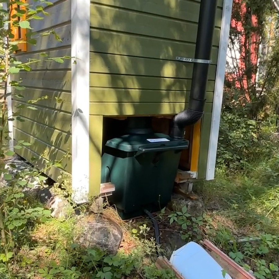 traditional outhouse from behind