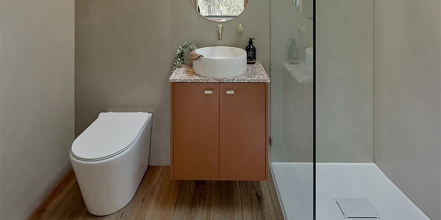 waterless toilet pedestal inside bathroom tiny house