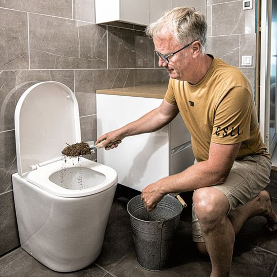 adding dry bulking material into the waterless toilet