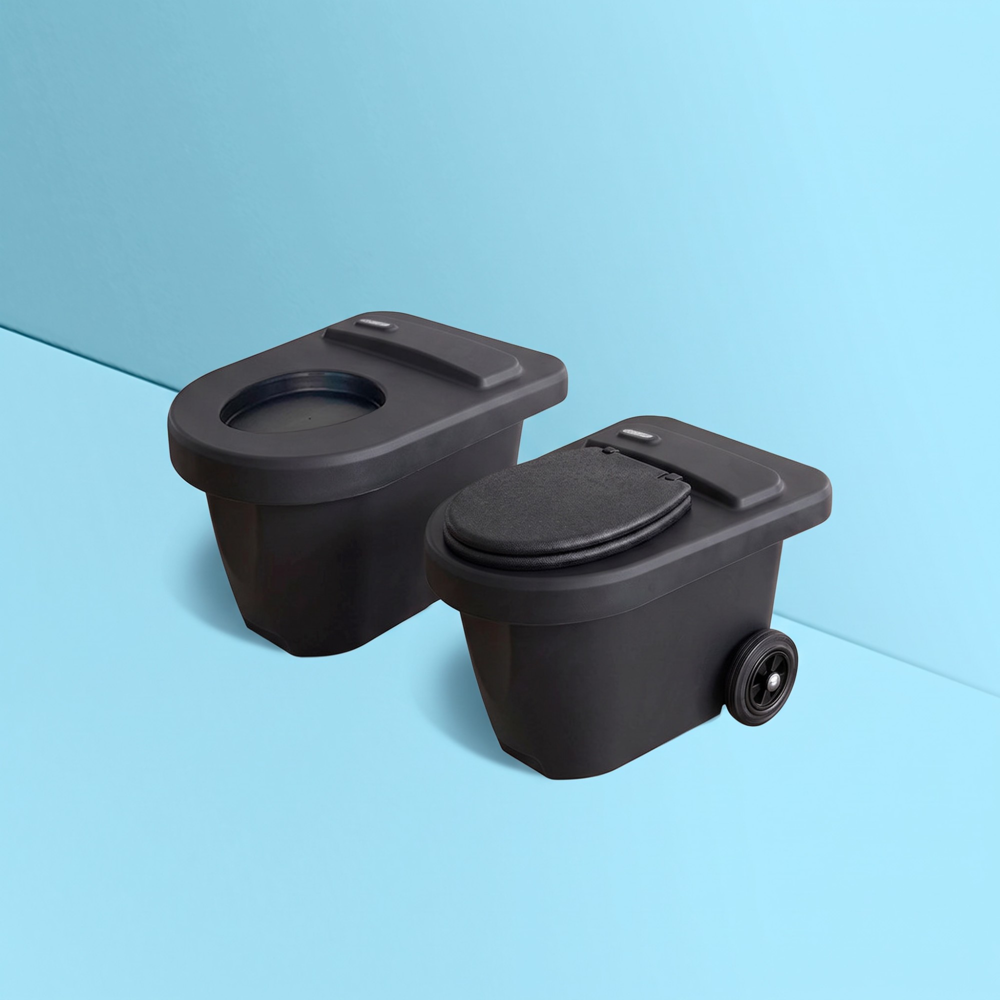 The black Green Toilet 100 Easy waterless toilet, seat lid closed, beside its swap container with the cover in place